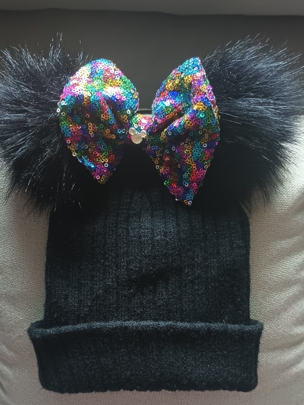Disney Black Beanie / Toboggan with Rainbow Sequin Bow and Black Faux Fur Poms